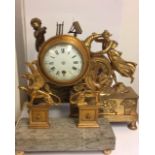 A COLLECTION OF THREE EARLY 19TH CENTURY GILT BRONZE MANTEL CLOCK CASES The circular clock with