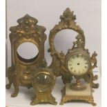 THREE 19TH CENTURY GILT BRONZE CLOCK CASES Along with one gilt spelter. (l 23cm)