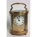 BAYARD, PARIS, A LATE 19TH/EARLY 20TH CENTURY FRENCH GILT BRASS OVAL CARRIAGE CLOCK Four convex