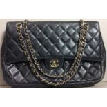 A VINTAGE CHANEL BLACK QUILTED LEATHER DOUBLE FLAP HANDBAG Diamond quilt pattern with gilt chain and