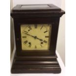 WINTERHALDER & HOFMEIR, GERMAN, A 19TH CENTURY OAK CHIMING MANTEL CLOCK Having bevelled glass panels