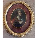 A FINE EARLY 19TH CENTURY FLORENTINE SCHOOL OVAL OIL ON PANEL Of Mary Magdalene holding the grail,