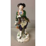 SITZENDORF, A 20TH CENTURY PORCELAIN FIGURE OF A GENTLEMAN GARDENER Of the 18th Century in a tricorn