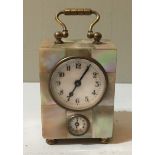 A 19TH CENTURY MINIATURE MOTHER OF PEARL CASED ALARM CLOCK With subsidiary dial. (7cm x 4.7cm x 3.