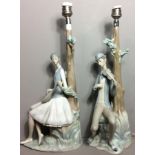 LLADRO, A PAIR OF VINTAGE PORCELAIN FIGURAL LAMPS Modelled as musicians seated beneath tall trees,