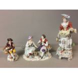 SITZENDORF, THREE PORCELAIN FIGURES To include a lady gardener, a group of a couple with gold finch,