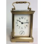 AN EARLY 20TH CENTURY GILDED BRASS CARRIAGE CLOCK Having Arabic numerals and subsidiary dial. (