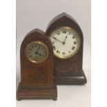 A LATE 19TH CENTURY AMBOYNA CASED CLOCK OF GOTHIC DESIGN Along with a mahogany and inlaid clock of