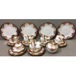 AN EARLY 20TH CENTURY WEDGWOOD PORCELAIN TEA SERVICE Comprising eleven tea cups, saucers, side