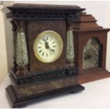 AN EARLY 20TH CENTURY ROUGE MARBLE MANTEL CLOCK Having tapering support pillars, together with a