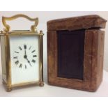 A LATE 19TH/EARLY 20TH CENTURY FRENCH GILDED BRASS CARRIAGE CLOCK Having four bevelled glass