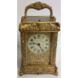 J.W. BENSON, A LATE 19TH CENTURY GILDED BRONZE REPEATING CARRIAGE CLOCK The case cast with swans,