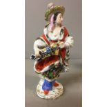 MEISSEN, AN EARLY 20TH CENTURY PORCELAIN A LADY HURDY GURDY PLAYER In exotic chinoiserie costume.