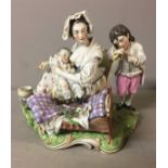 AN EARLY 19TH CENTURY CONTINENTAL PORCELAIN GROUP OF A MOTHER NURSING A CHILD Whilst a young lady