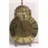 A 19TH CENTURY BRASS LANTERN CLOCK Having a domed bell and pierced brass finials, the dial marked '