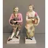 A PAIR OF 19TH CENTURY CONTINENTAL PORCELAIN FIGURE In late 17th Century costume, the man carrying a