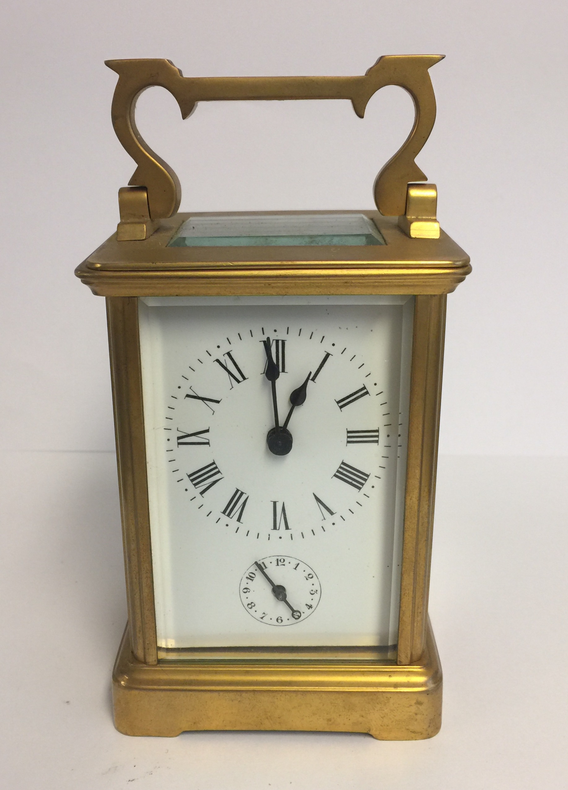 A LATE 19TH/20TH CENTURY GILDED BRASS CHIMING CARRIAGE CLOCK Subsidiary dial, chimes on a bell. (