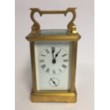 A LATE 19TH/20TH CENTURY GILDED BRASS CHIMING CARRIAGE CLOCK Subsidiary dial, chimes on a bell. (