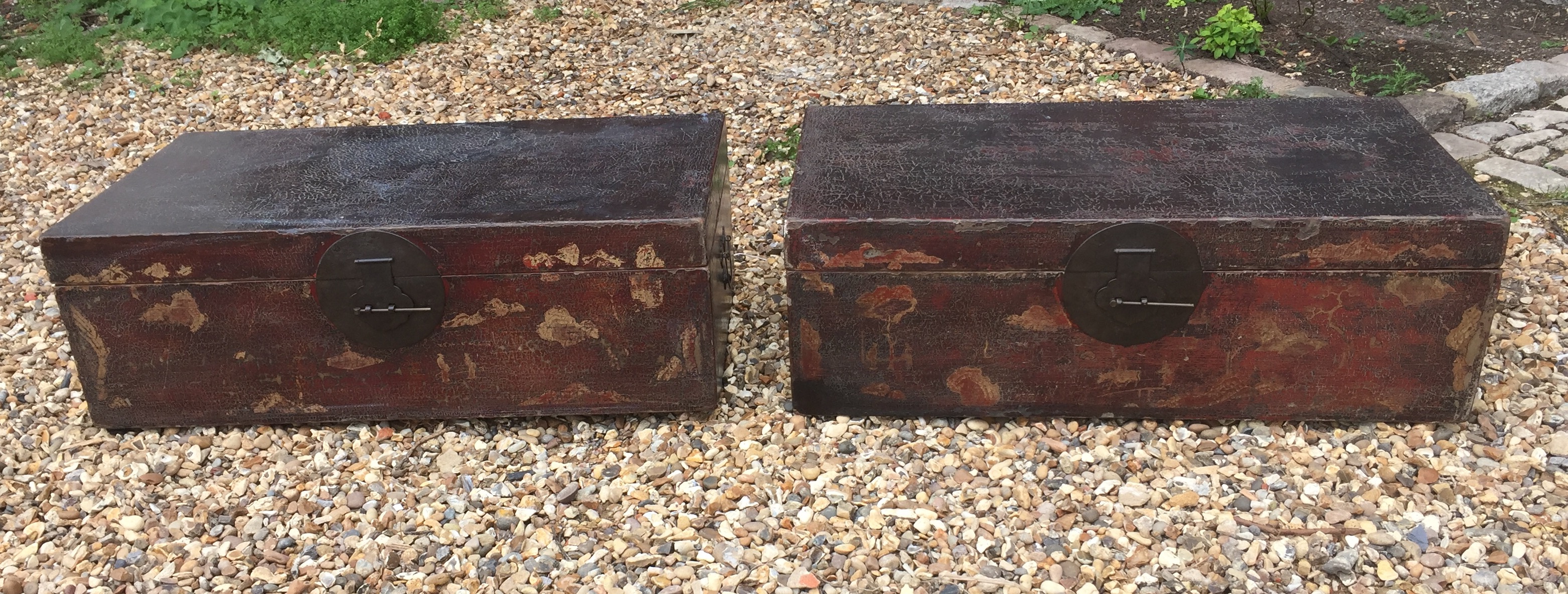 A PAIR OF 19TH/20TH CENTURY CHINESE TRAVELLING TRUNKS In distressed lacquered finish, with brass