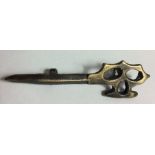 A WORLD WAR II BRITISH COMMANDO MIDDLE EAST BRASS CAP BADGE Modelled as a dagger with a