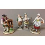 SITZENDORF, A PAIR OF 20TH CENTURY PORCELAIN FIGURES To include a man feeding a caged rabbit and a