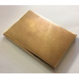 A 20TH CENTURY 9CT GOLD CIGARETTE CASE With engine turned decoration and interior inscription 'James