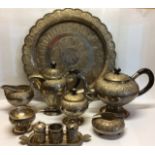 A 20TH CENTURY EIGHT PIECE MALAYAN SILVER TEA SET The serving tray having a scalloped edge and