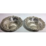 A PAIR OF VICTORIAN SILVER OVAL SWEETMEAT DISHES With embossed floral design and pierced trellis