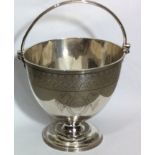 A VICTORIAN SILVER SWEETMEAT BASKET The swing handle having a reeded design and conical shape