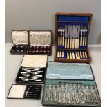 GOLDSMITHS & SILVERSMITHS CO., A CASED SET OF CUTLERY Along with a collection of cased hallmarked