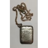 A 9CT GOLD ALBERT CHAIN Sold together with a 1920's silver vesta case, having chased foliate