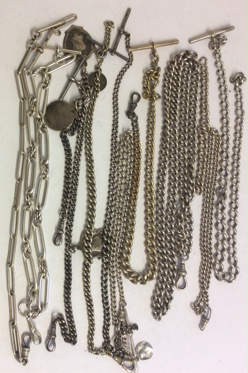 A COLLECTION OF VICTORIAN SILVER ALBERT CHAINS Including two dog link chains, a silver gilt chain