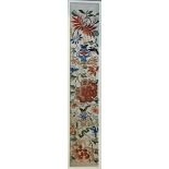 A CHINESE SILK EMBROIDERED SLEEVE PANEL Circa 1910, framed. (50cm x 9cm)