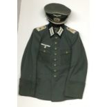 A GERMAN INFANTRY OFFICER'S 79TH DIVISION TUNIC AND CAP Named and dated '38. Condition: some