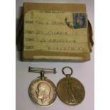 A PAIR OF WORLD WAR I MEDALS Named 'G. Springett, PTE, A.S.C.' and contained in original box.