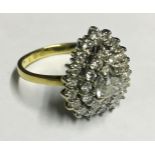 AN 18CT YELLOW GOLD AND DIAMOND HEART FORM RING With a large central diamond standing on two
