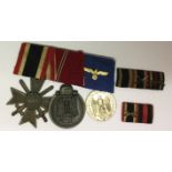 A WORLD WAR II GERMAN MEDAL TRIO PIN BAR Including two ribbon bars.