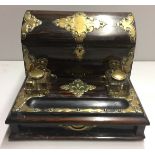 A VICTORIAN COROMANDEL AND HEAVY BRASS DESK WRITING BOX With three glass ink bottles.