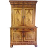 A 19TH CENTURY FRENCH MAHOGANY DRESSER With deep cushion cornice above an arrangement of panelled