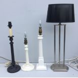 FOUR VARIOUS TABLE AND DESK LAMP BASES Comprising a French Empire style bronzed metal candlestick,