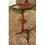 A 19TH CENTURY FRENCH WALNUT TWO TIER OCCASIONAL TABLE Raised on a triform base. (h 76cm x d 40cm)