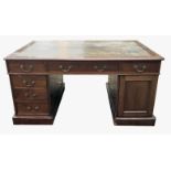 A VICTORIAN MAHOGANY PARTNERS DESK With green tooled leather top above an arrangement of drawers and