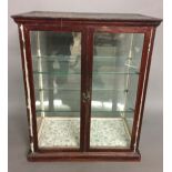 A LATE VICTORIAN MAHOGANY TABLE TOP DISPLAY CABINET With two glazed panelled doors enclosing two