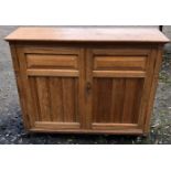 A LATE 19TH CENTURY ASH FLOOR STANDING CUPBOARD With two doors, raised on squat legs with