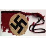 REMAINS OF SS ARMBAND Rondel bearing swastika. Condition: wool badly mothed