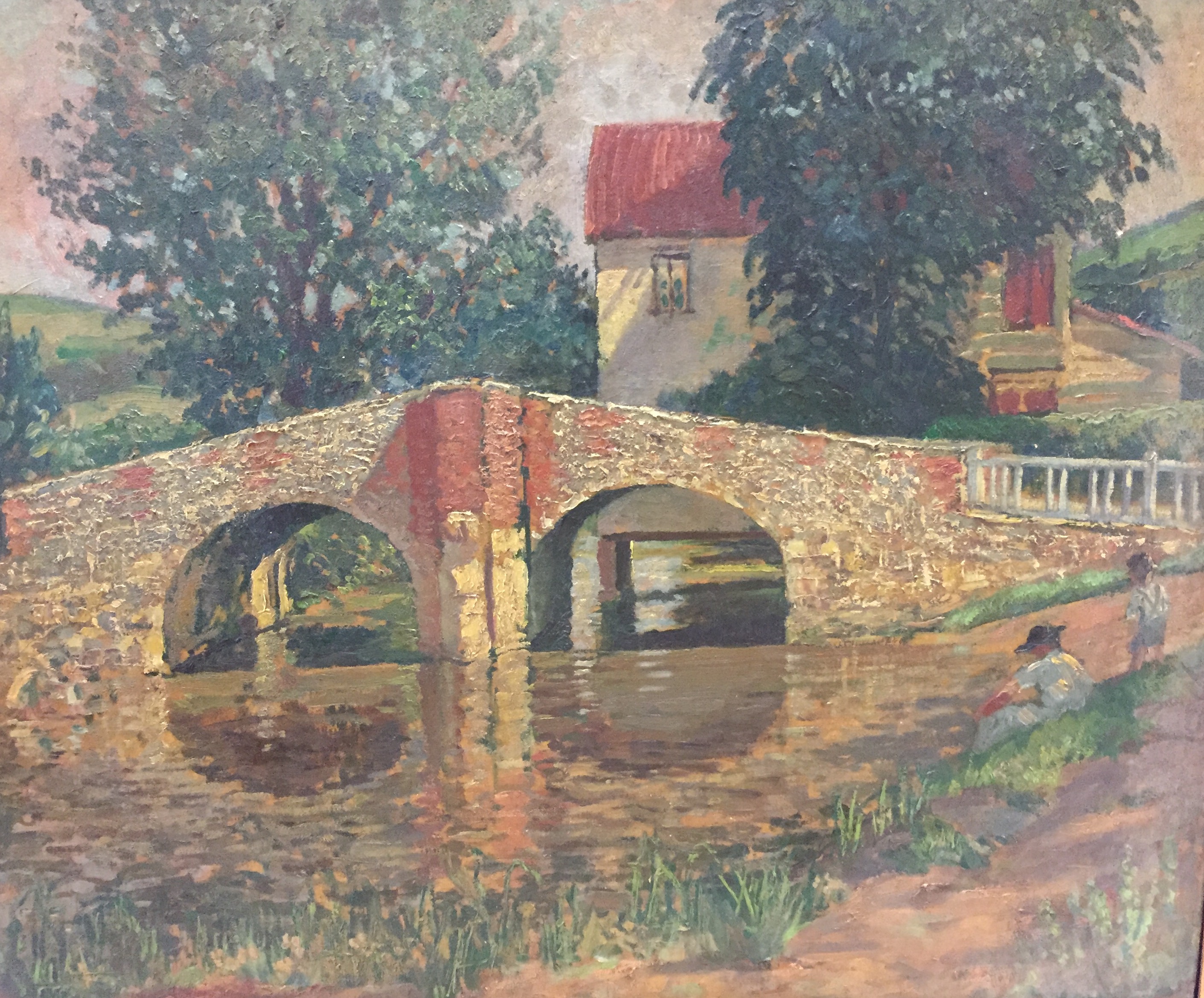 A MODERN BRITISH SCHOOL OIL ON CANVAS 'Bridge over a stream by a mill', Circa 1930 and framed. (63cm