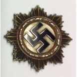 A GERMAN GOLD AND ALUMINIUM METAL CROSS, 1941 On wreath and nol on pin. Condition: very good