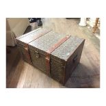 A VINTAGE LEATHER CLAD TRAVEL TRUNK The embossed leather exterior decorated with stylized flowers