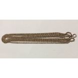 A VICTORIAN 9CT GOLD LADIES' GUARD CHAIN Having a box link design.