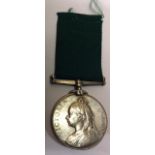 A VICTORIAN VOLUNTEER FORCE MEDAL AND RIBBON LONG SERVICE MEDAL.